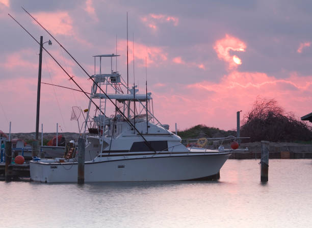 istock fishing boat at sunrise 172279471