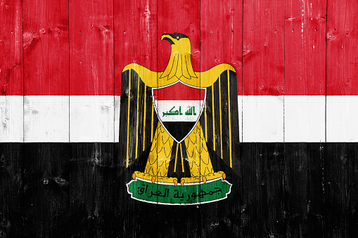 Flag and coat of arms of Republic of Iraq on a textured background. Concept collage.