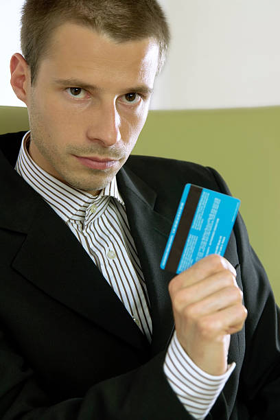 istock Man with credit card 172279635