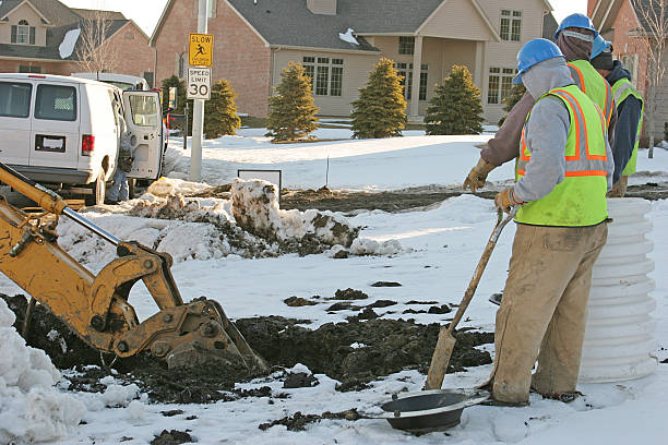 Water workers planning changes to pipes on snowy day