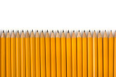Row of Yellow Pencils Repetition for Education on White Background