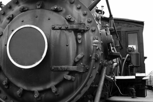 front of steam engine black and white