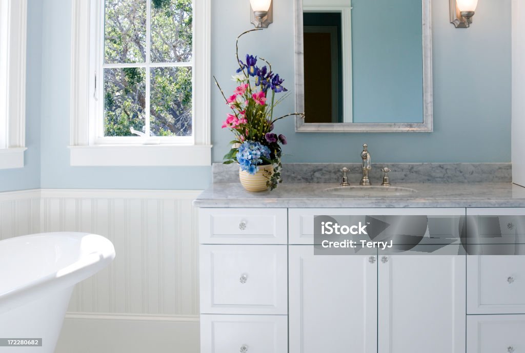Bathroom Sink Sink vanity with free-standing tub on the side. Medicine Cabinet Stock Photo