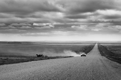 Subject: The rural gravel road of South Dakota in a stormy day