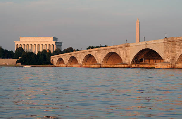 Arlington Bridge, Lincoln Memorial and National Monument, Washington DC Arlington Memorial Bridge with the Lincoln Memorial and the National Monument in the background shot in the golden glow of the setting sun. arlington memorial bridge photos stock pictures, royalty-free photos & images