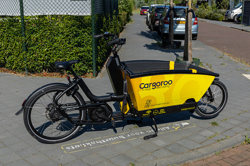 Utrecht, the Netherlands. 08 July 2023. Rental Cargoroo neighborhood cargo bike. Cargoroo is an electric shared cargo bike that you can rent for a short or longer period of time.