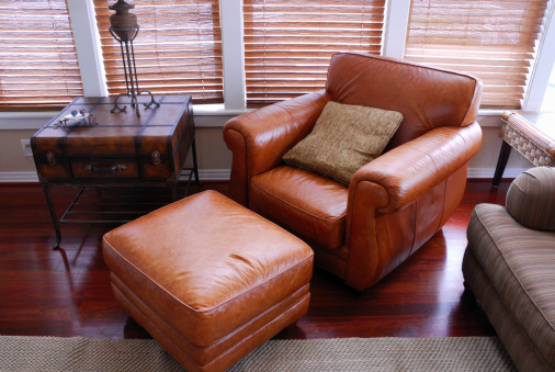 A large leather chair and footstool for snoozing