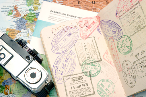 Passport, airlines ticket, map and camera are every traveler essential items.