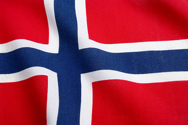 The Norwegian flag waving in the wind Textile Flag of Norway. Studio Shot. norwegian flag stock pictures, royalty-free photos & images
