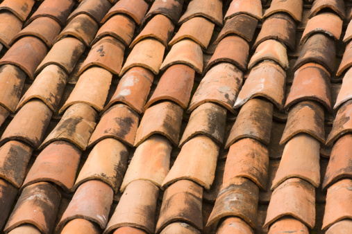 Subject: Close-up horizontal view of weathered red clay roof tilesLocation: West central Mexico