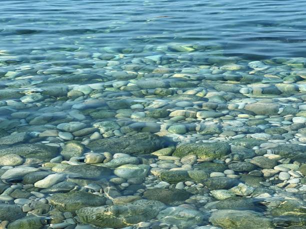 istock Clear water with pebbles and stones at the bottom. 1722827619