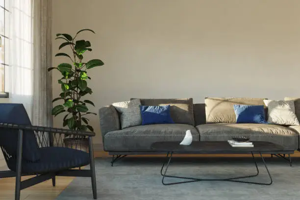 Modern living room setup with gray sofa, blue arm chair with wooden frame, wooden coffee table and gray carpet.