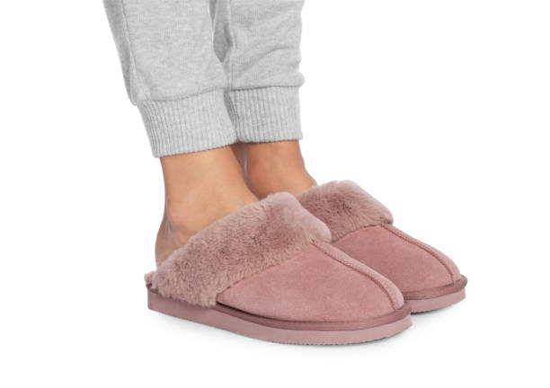 istock Woman in warm soft slippers on white background, closeup 1722828722