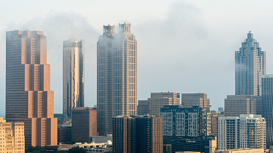 Clouds covering skyscrapers in Downtown of Atlanta, Georgia. Hotels and office building exterior of capital city