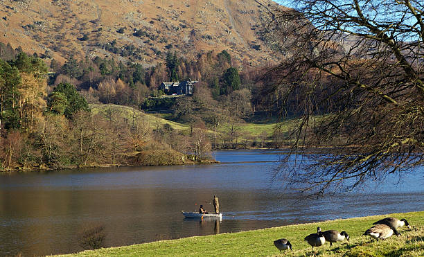 istock Fishermen in a boat on an English lake 172283544