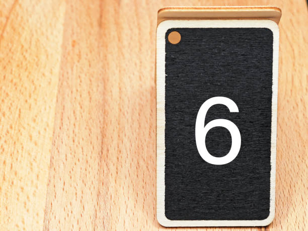 istock number six black and white with wooden background 1722843154