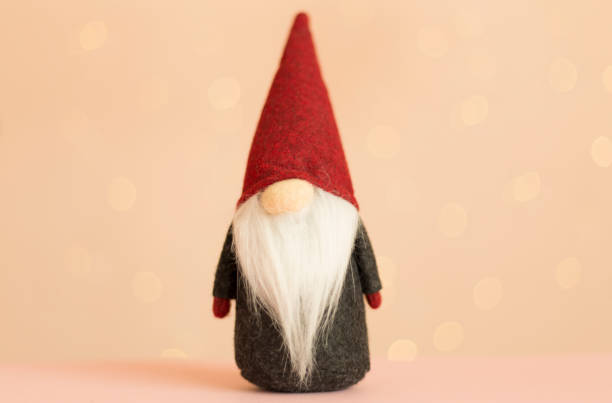 istock Christmas dwarf on table against blurred lights 1722844234
