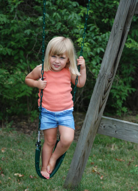 istock Blonde Haired Beauty on a Swing 172284463
