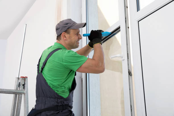 istock Worker in uniform installing double glazing window indoors 1722849691