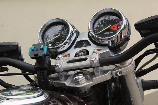 A photo of a master clamp for a black motorcycle.