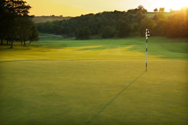 istock A golf course at dusk with trees in the distance 172285451