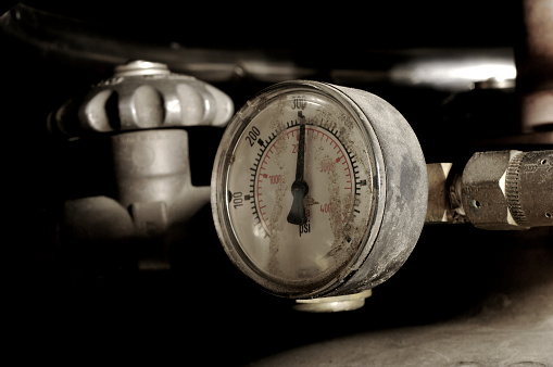 Industrial pressure gauge on a tank