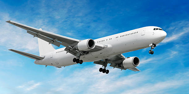 istock jet airplane landing in bright sky 172285838