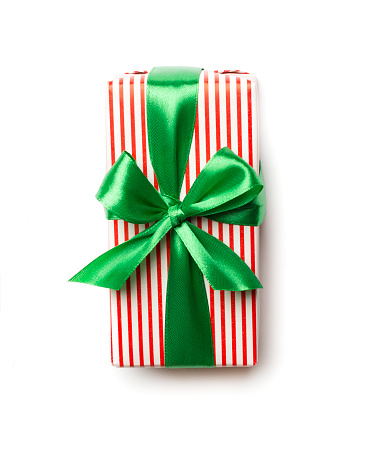 Gift box with green ribbon bow isolated on white, top view.