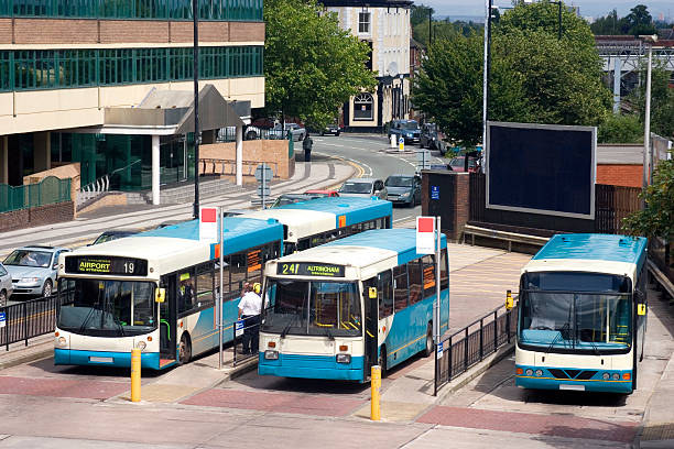istock Blue buses waiting at a station in a small city 172286103