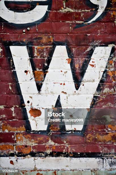 Letter W On Brick Wall Stock Photo - Download Image Now - Old, Paint, Wall - Building Feature