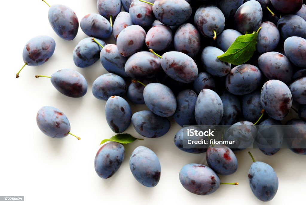 Plums Heap of plums on white background (soft shadow + clipping path) Autumn Stock Photo