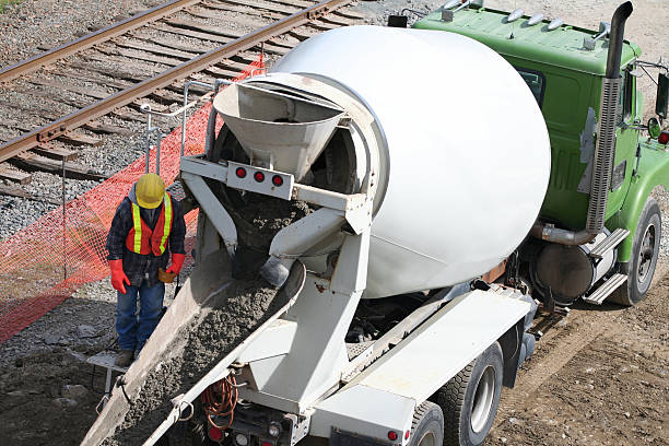 Rear view of concrete mixer electric truck isolated on gradient background. 3D rendering image.