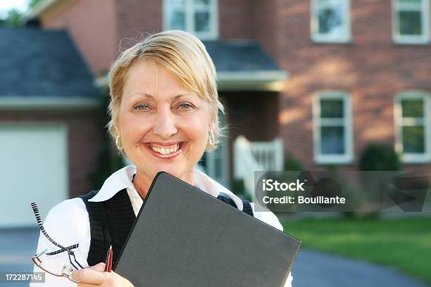 Smiling Agent Stock Photo - Download Image Now - 50-59 Years, Adult, Adults Only
