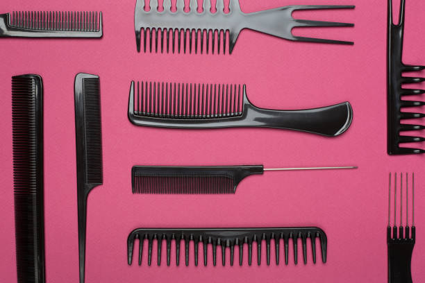 istock Professional combs and hairdresser tools on color background, top view 1722874888