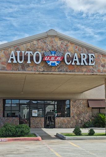 Houston, Texas USA 09-24-2023: Auto Care USA building storefront exterior in Houston, TX. Local automotive repair shop business.