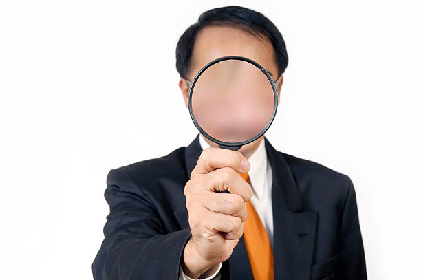 istock Businessman Holding Magnifying Glass 172287760