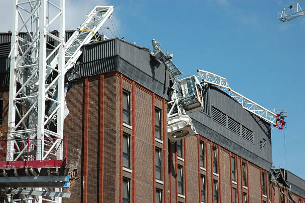 Whoops! "A tower crane jib falls from its upright onto the neighbouring Hotel in Croydon, South London. No one is killed, 4 people including operator seriously injured." collapsing stock pictures, royalty-free photos & images