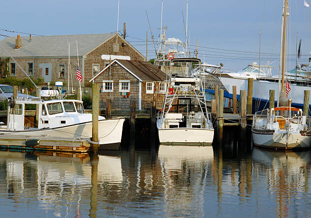 East coast marina "East coast marina (Hyannis port, Massachusetts, USA). More New England coast images in lightbox below..." skipjack stock pictures, royalty-free photos & images