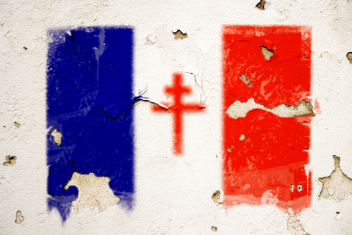 The flag of Free France from World War Two painted on a cracked and peeling wall.This series: