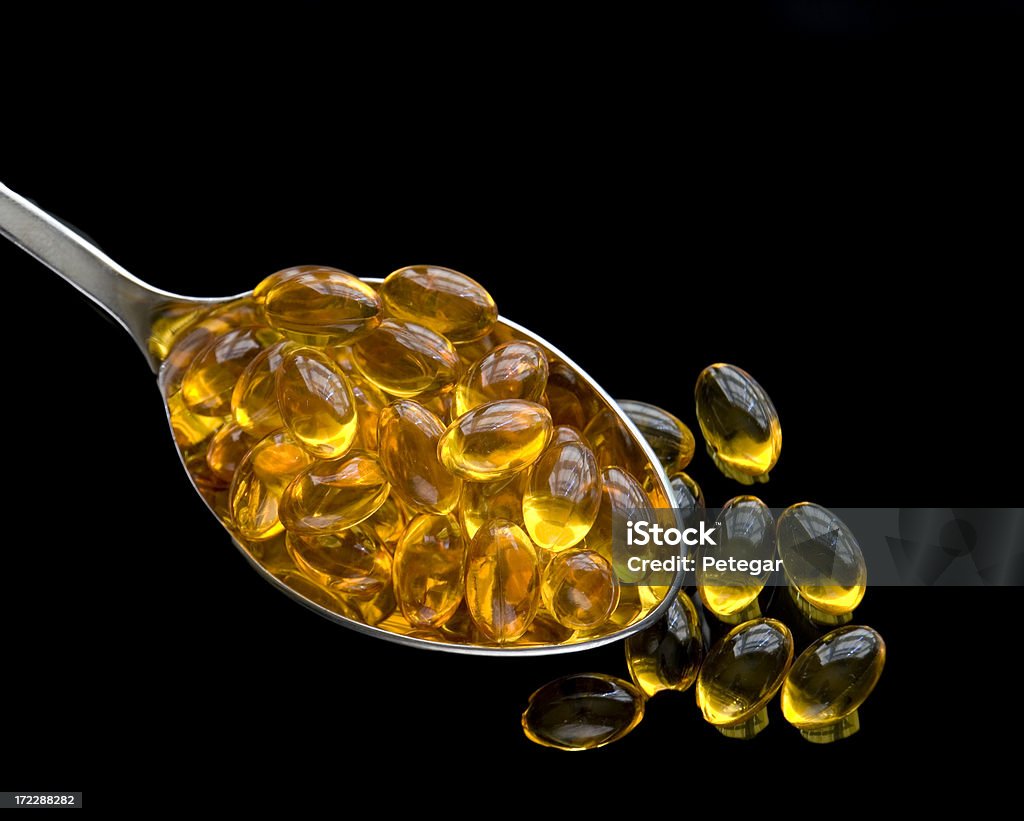 Cucharada de medicamento - Foto de stock de Aceite de hígado de pescado libre de derechos