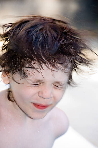 Shaking Off  Water Shaking off water from a hair. mm1 stock pictures, royalty-free photos & images