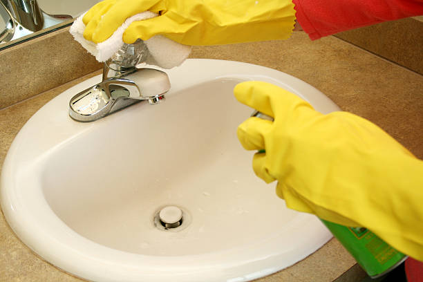 A woman cleans her house