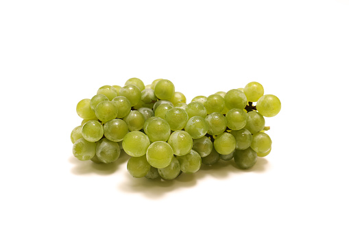 Green grapes isolated on a white background.