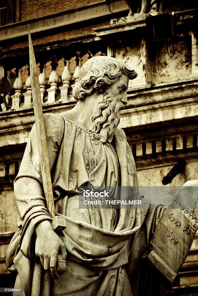 St. Paul in the vatican "Near the stairs to the basilica at the front of the square is the colossal statue of St. Paul, patron saint of Rome. Ordered by Pope Pius IX on Easter 1847, who wanted to replace the existing smaller one. Paul was sculpted in 1838 by Adamo Tadolini, and is 5.55m in height, on a pedestal 4.91m high." Ancient Stock Photo