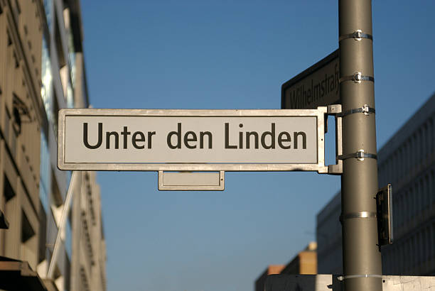 Unter den Linden Street sign of Unter den Linden - the famous Boulevard that leads to the Brandenburg Gate in Berlin. street name sign stock pictures, royalty-free photos & images