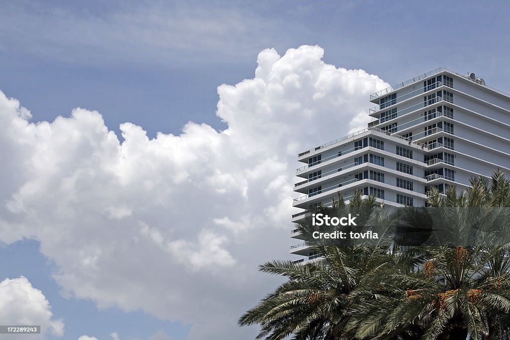 Condo with Puffy Clouds Miami Beach Condominium with puffy clouds and palm trees Apartment Stock Photo