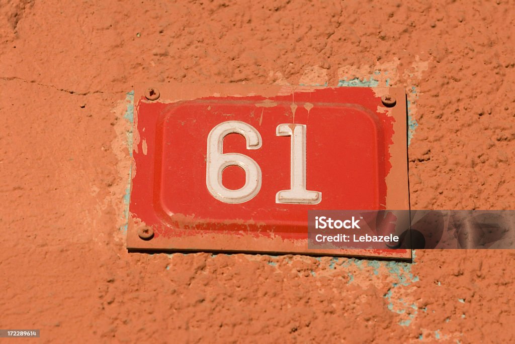 Number plate on a wall. - Photo de 60-64 ans libre de droits
