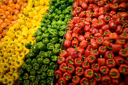 A lot of peppers in a market.