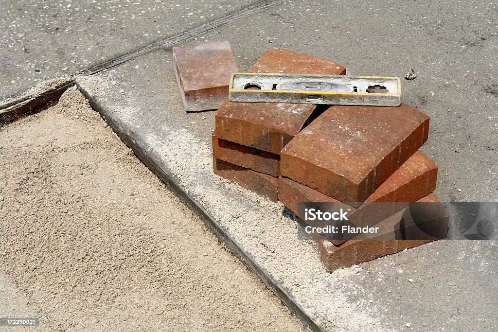 Paver Stones & Level           Some paver stones that are to be placed into the sand                      Driveway Stock Photo