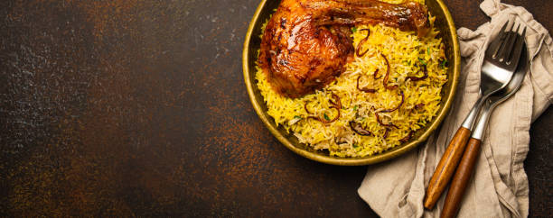istock Indian dish Biryani chicken with basmati rice in metal brass old bowl on table 1722901313